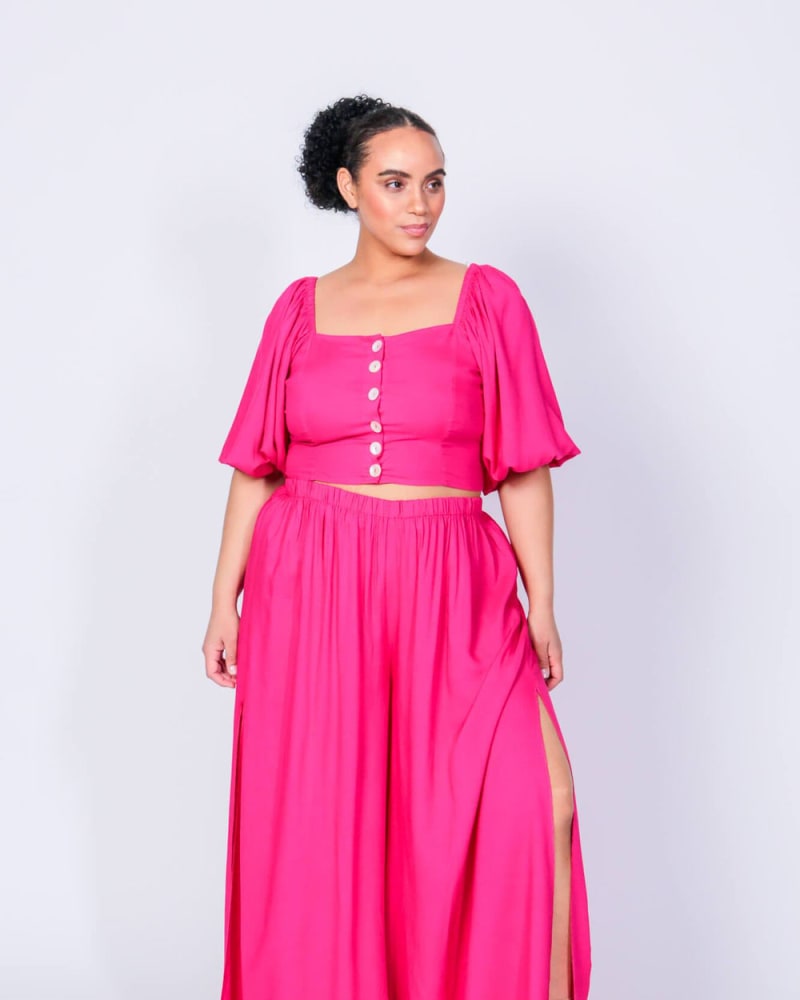 Front of a model wearing a size L Gladys Crop Top and Pants Set in Beetroot Purple by LuvMeMore. | dia_product_style_image_id:266637